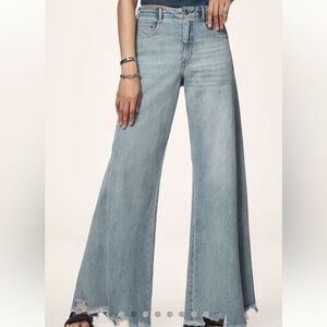 Mid rise frayed relaxed flare jeans